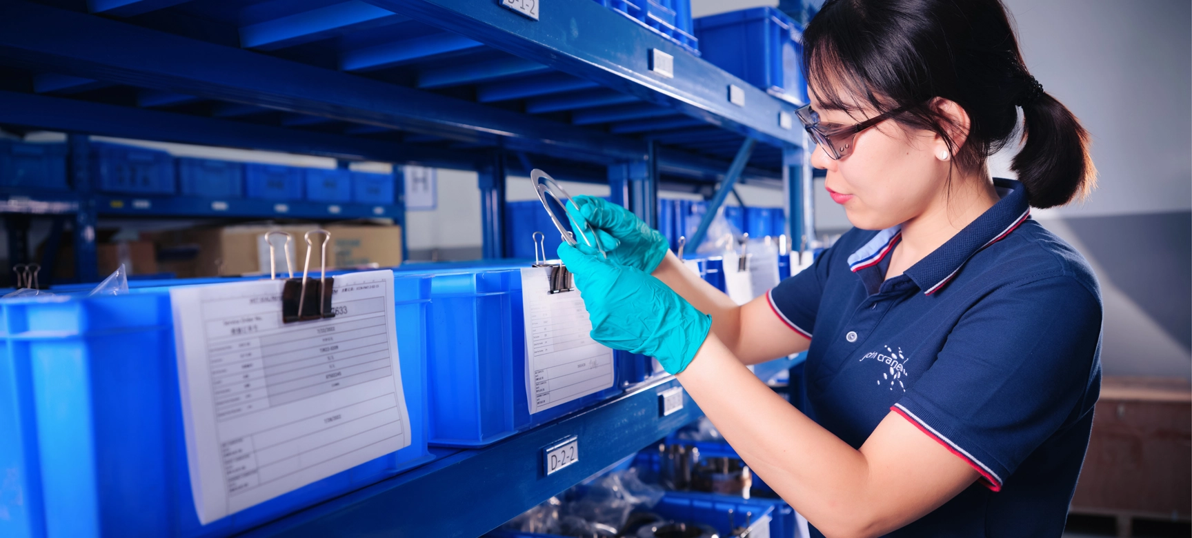 John Crane Employee Examing Product