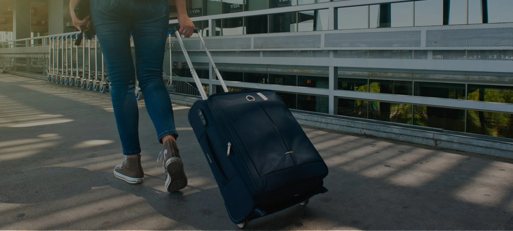 Person with suitcase at airport