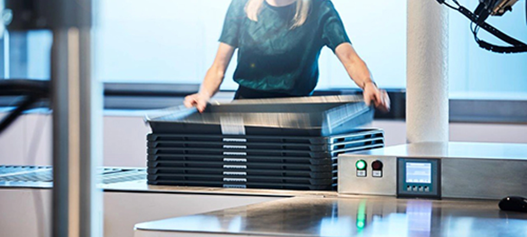 Person with checkpoint trays