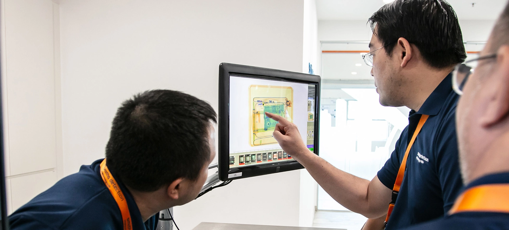 People inspecting scan